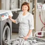 Senior Washwoman In The Laundry