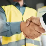 Partnership, Handshake And Collaboration Of Engineer In Office For Contract, Deal Or Onboarding. Architecture, Thank You And People Shaking Hands For Hiring, Recruitment Or Agreement, B2b Or Greeting