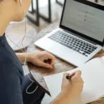 Online Studying Concept A Black Haired Student Doing His Homewor