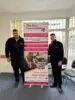 Employees of the Tamworth branch stood with new driving desk roller banner to promote new services.