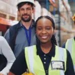 People, Warehouse And Happy On Portrait For Teamwork, Collaboration And Supply Chain. Employee, Diversity And Smile At Factory For Logistics, Manufacturing And Delivery Or Distribution Service