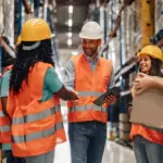 Warehouse Workers Shaking Hands After A Successful Deal