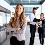 Happy Young Business Woman In Office Environment