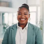 Career, Black Woman And Portrait In Office For Business, Laughing And Pride For Conference. Professional, Female Person And Public Relations Manager With Confidence For Event, Ambition And Positive