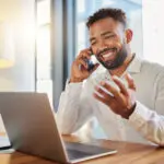 Business, Corporate And Client Deal Phone Call Of A Businessman Working At An Office Computer. Sales Marketing Business Man With A Smile Happy About Career Success, B2b Bonus Or Executive Promotion