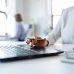 Businesswoman With Laptop Working At Office