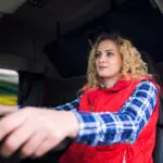 Truck Driver. Female Employee Driving Truck Vehicle. Transportation Service.