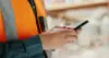 Social Media, Internet And Hands Of An Architect With A Phone For Communication, Construction Website And Building App. Construction Worker Working On A Mobile, Typing On Web And Doing Search On Site
