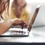 Young Boy Hitting The Keyboard In A Classroom, Completing A Digital Literacy Task