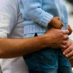 Intimate Gesture Of Trust Between A Father And His Son