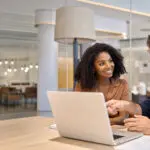 Diverse Team Professional Employees Working Together On Computer In Office.