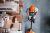 Top View Of Male Worker In Warehouse With Pallet Truck