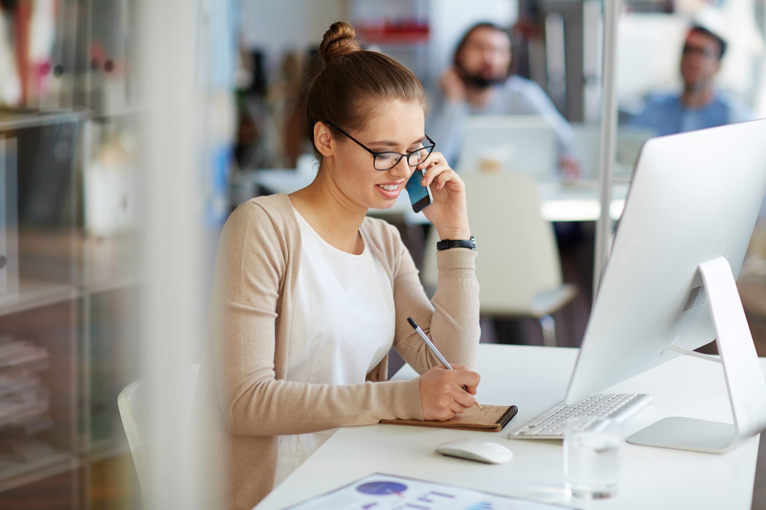 Businesswoman On Phone With Partners