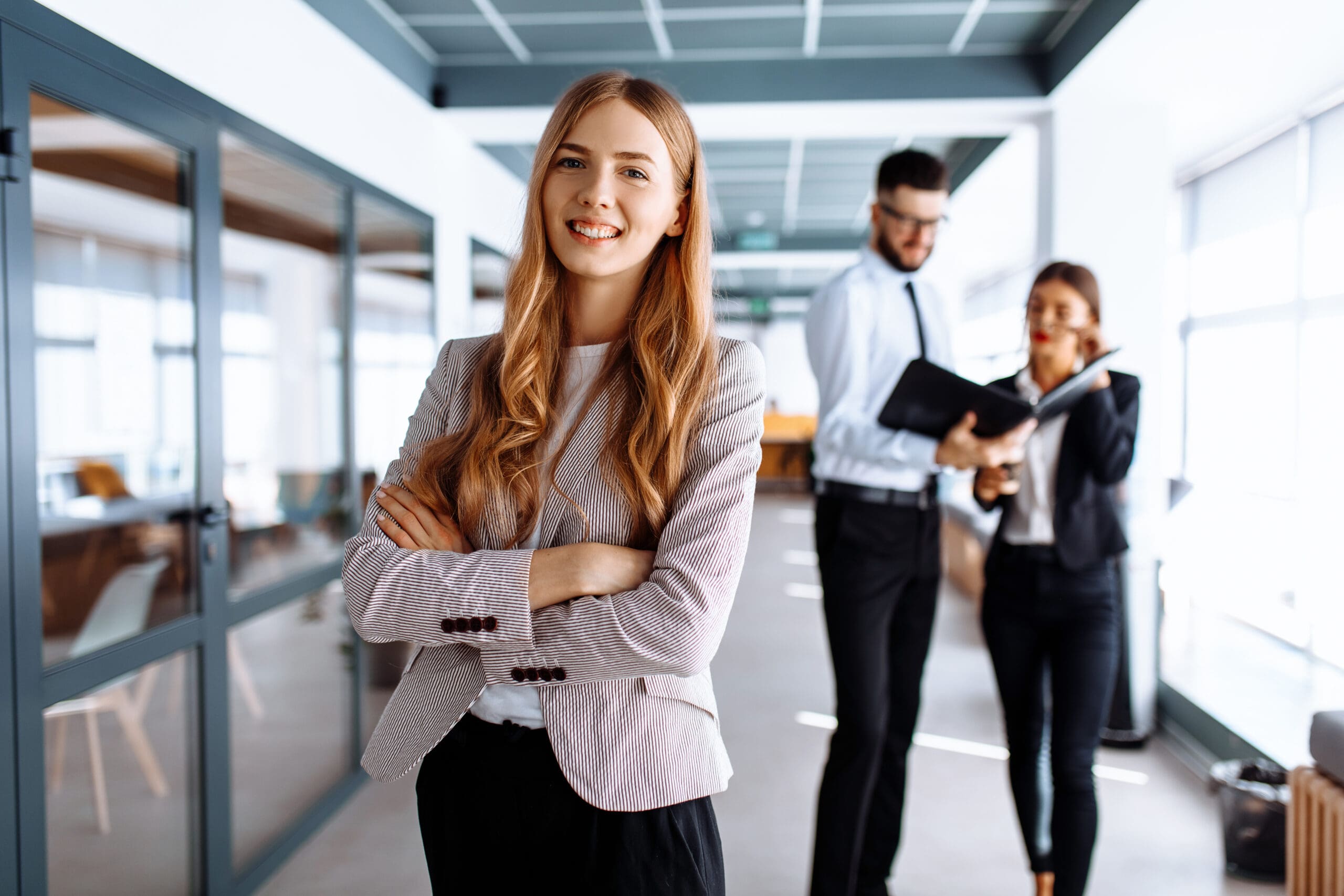 Happy Young Business Woman In Office Environment