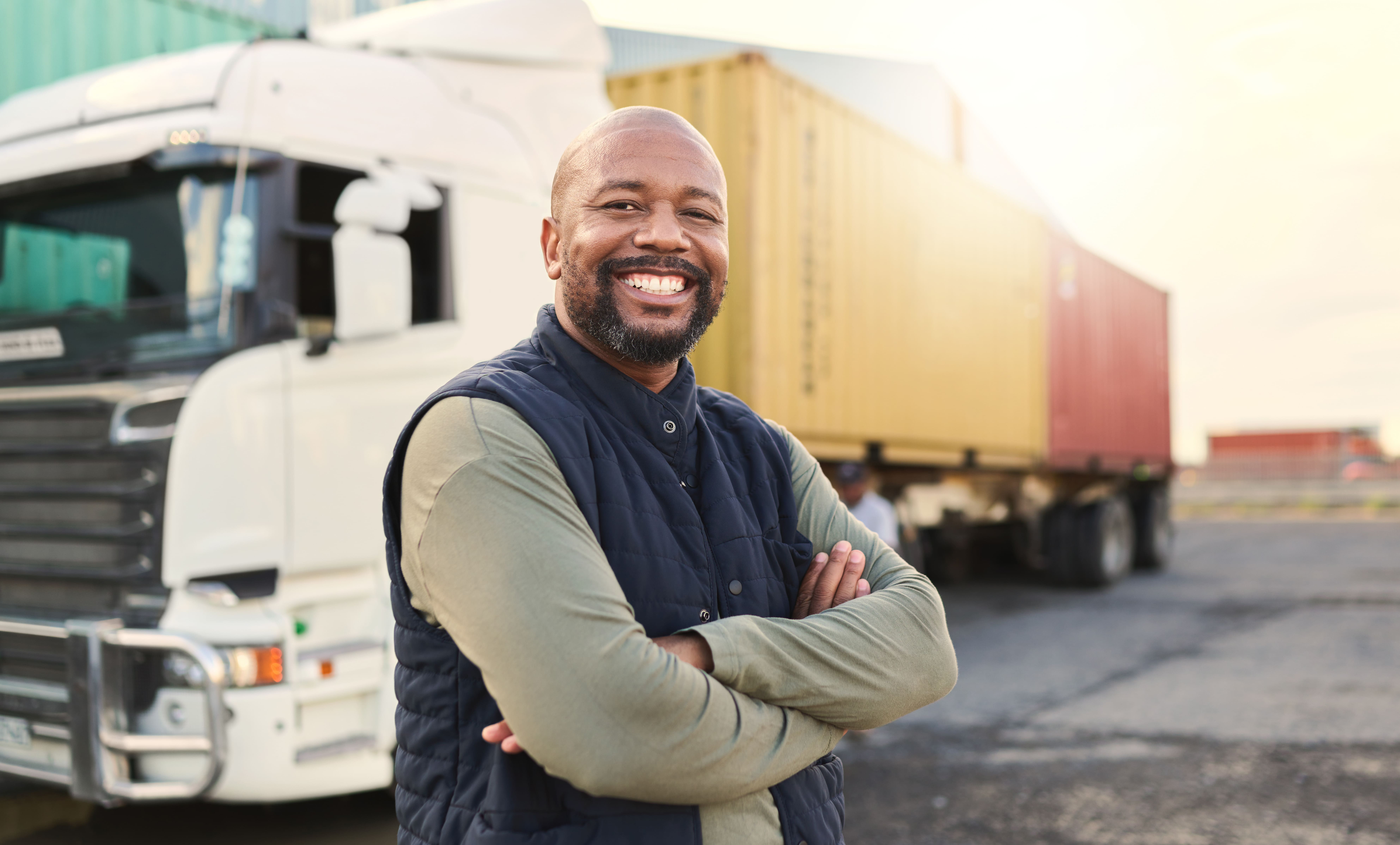 Delivery, Container And Happy Truck Driver Moving Industry Cargo And Freight At A Shipping Supply Chain Or Warehouse. Smile, Industrial And Black Man Ready To Transport Ecommerce Trade Goods Or Stock