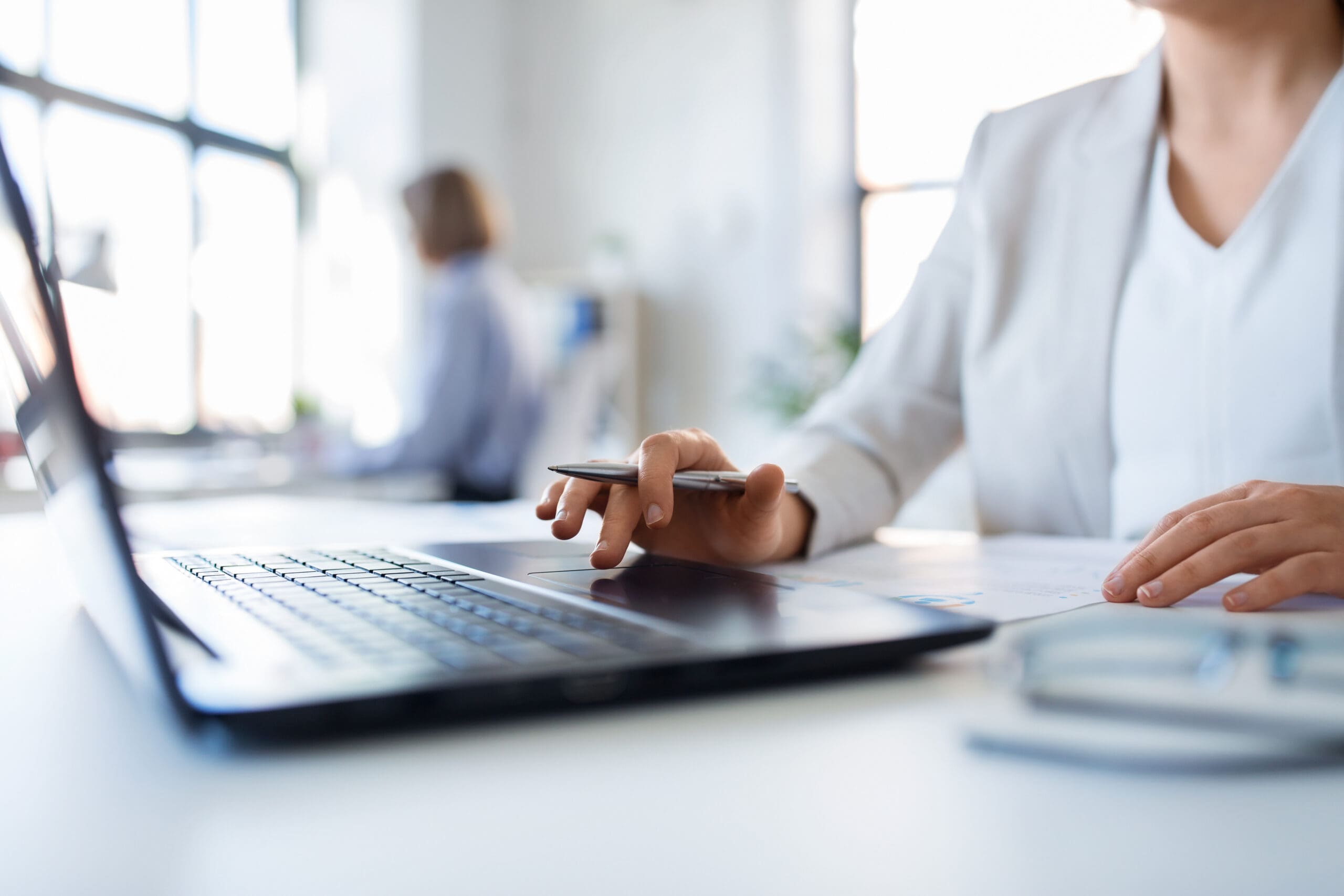 Businesswoman With Laptop Working At Office