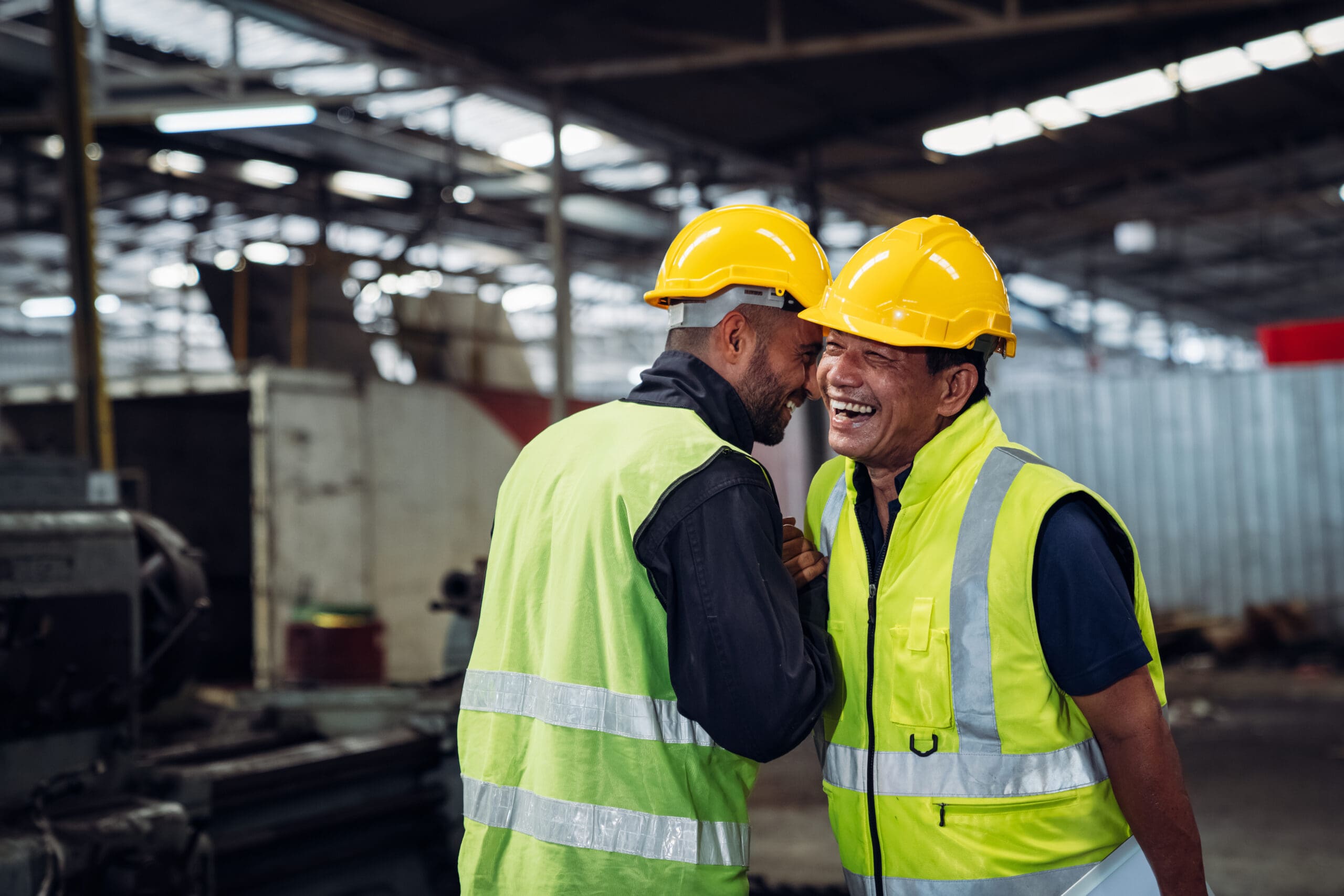 Team Engineer Is Shaking Hands. Industrial Worker In The Factory. Engineer Is Maintaining In The Warehouse.
