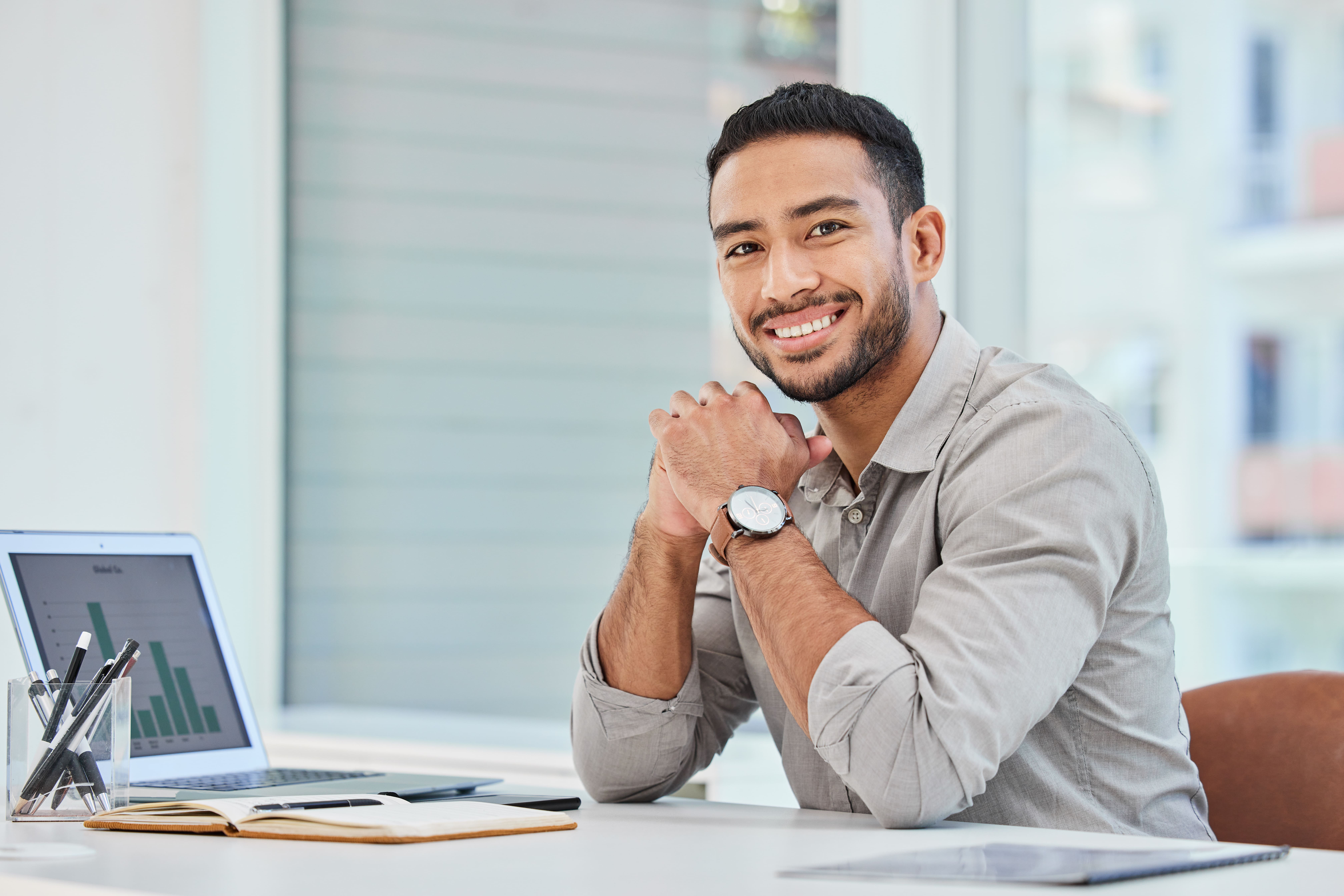 So Happy That I Got This Jjob. Shot Of A Young Businessman At Work In His Office.