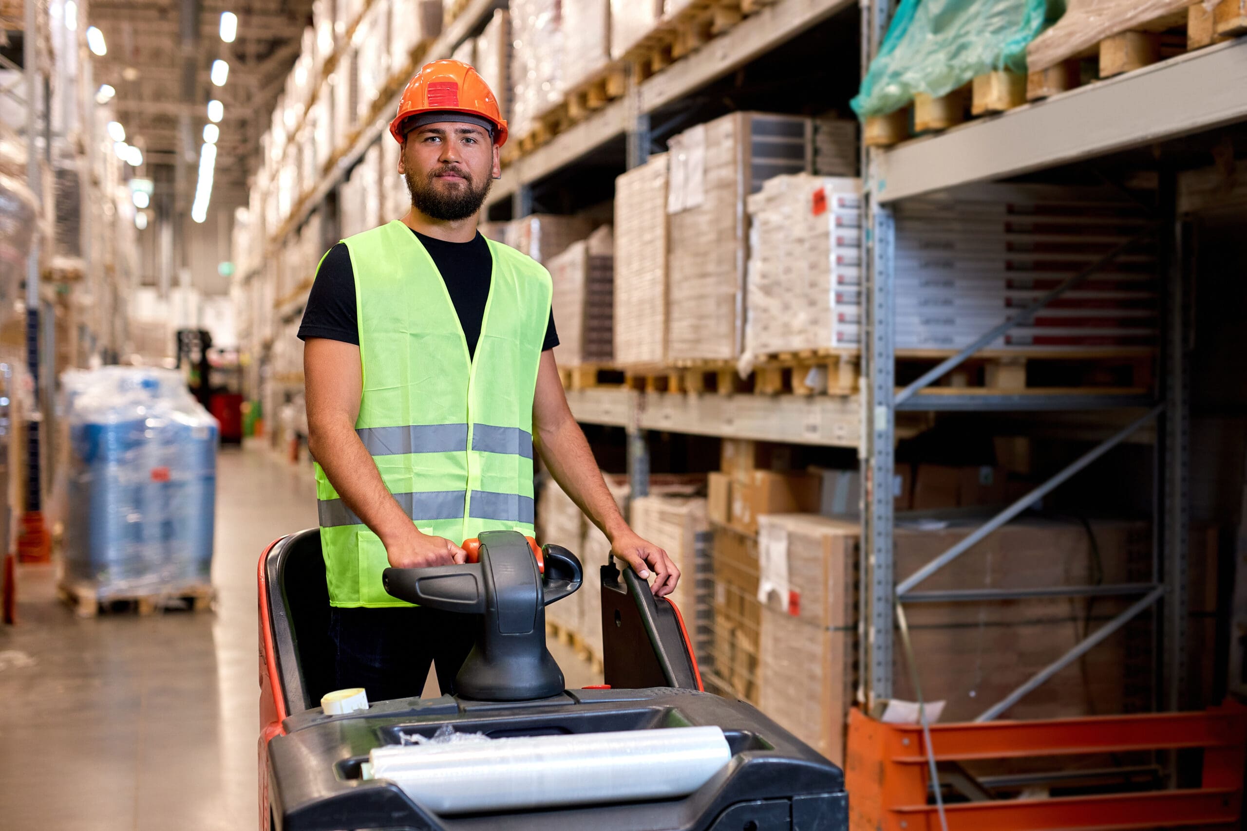 Male With Forklift In Warehouse. Freight Transport, Warehouse Industrial Delivery Shipment